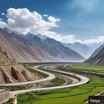 Home 16 타지키스탄의 경제적 이슈 - A detailed landscape scene of Tajikistan’s mountainous region with narrow winding roads used by truc...